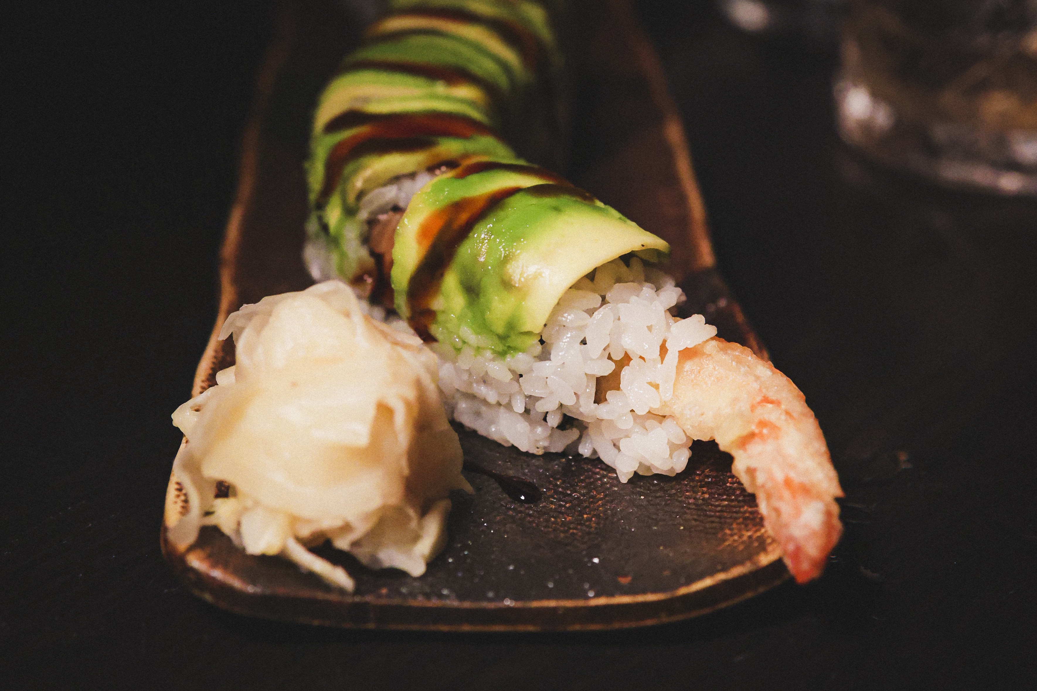Dragon Roll Prawn tempura, salmon, avocado, unagi sauce Cut Roll