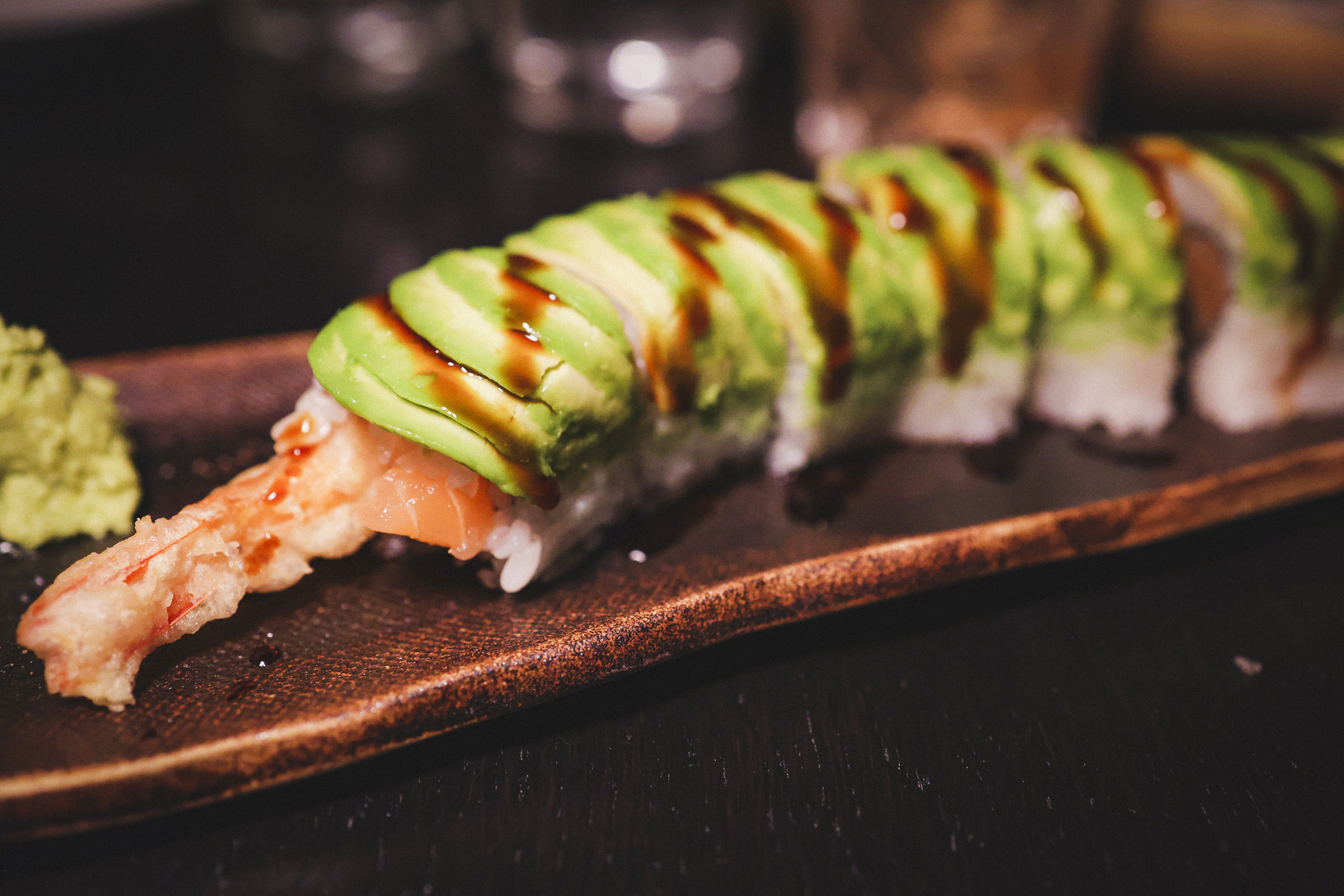 Dragon Roll Prawn tempura, salmon, avocado, unagi sauce Cut Roll