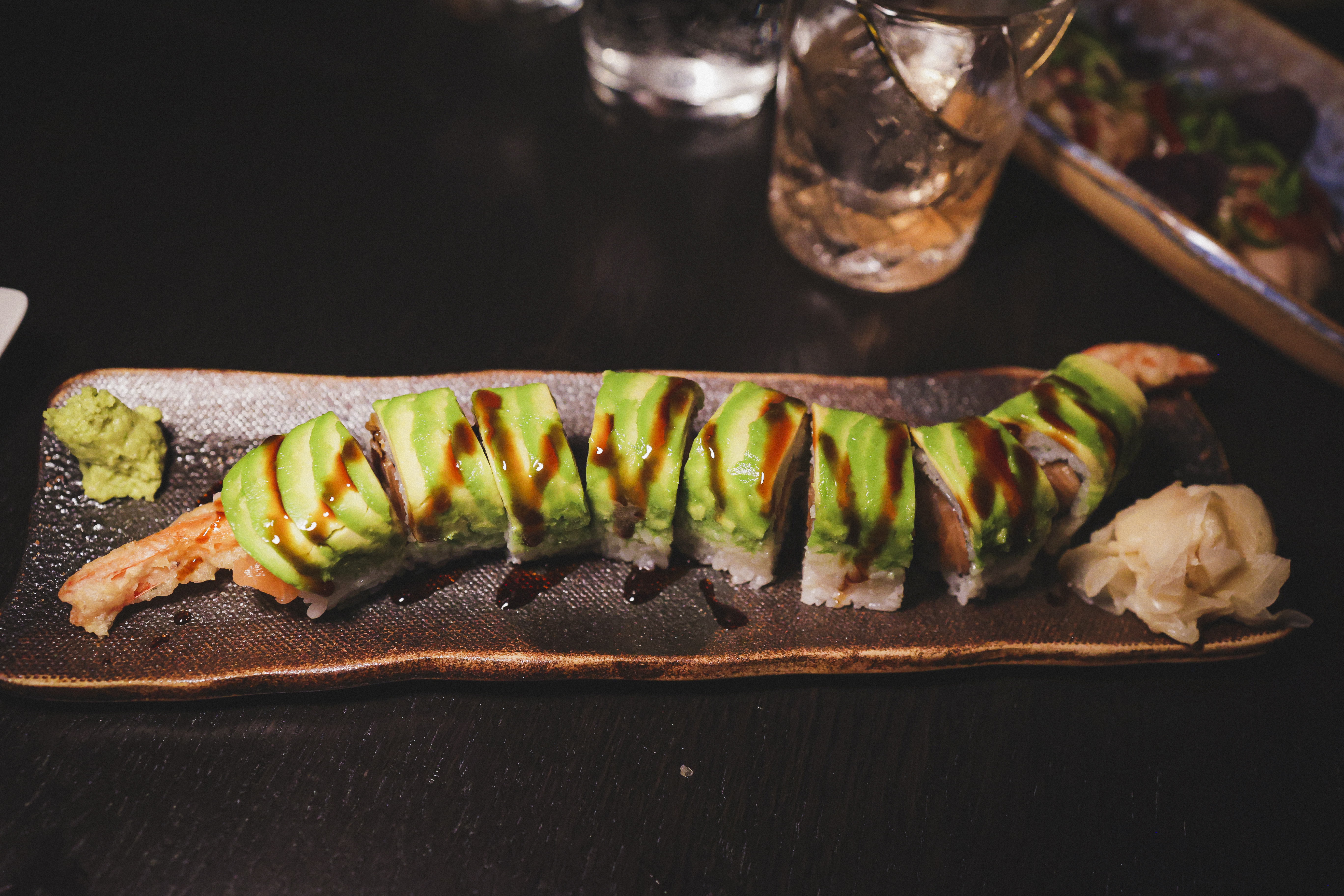 Dragon Roll Prawn tempura, salmon, avocado, unagi sauce Cut Roll