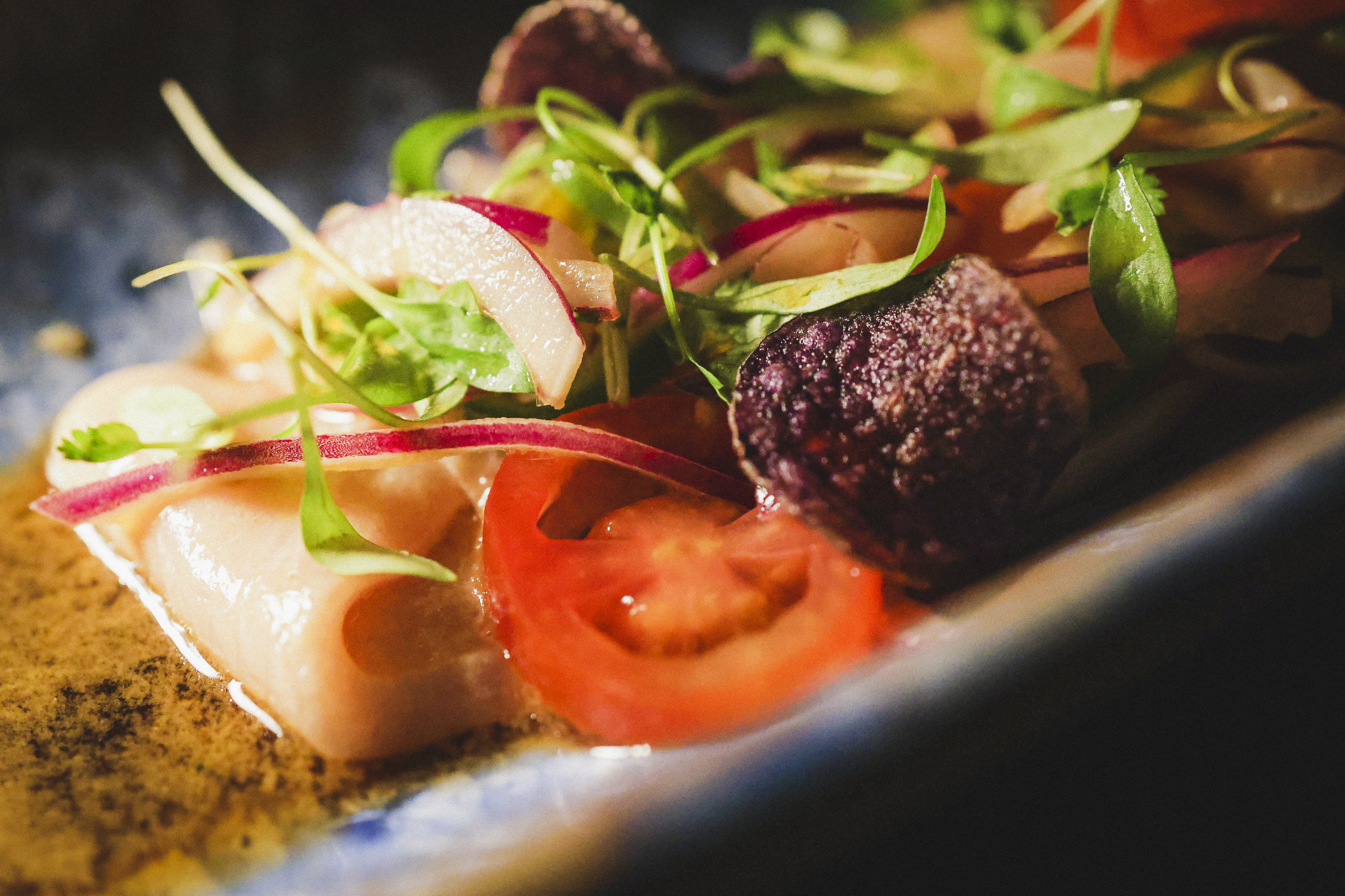 Yellowtail “Nikkei Sashimi” GF Cherry tomatoes, jalapeño, coriander, yuzu truffle soy